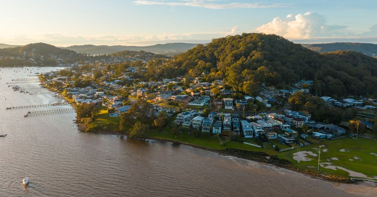 Aerial shot showcasing the coastal landscape of Gosford, Australia at sunset.